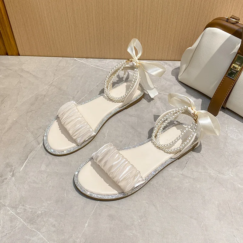

Сандалии на плоской подошве, женские летние новые уличные римские туфли с жемчужным бантом и стразами в сказочном стиле