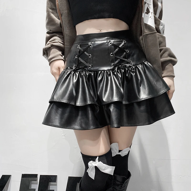 European and American Autumn and Winter Dark Style Cross Tie Double-Layer Splicing Pu Leather Zipper Pleated Short Skirt Woman