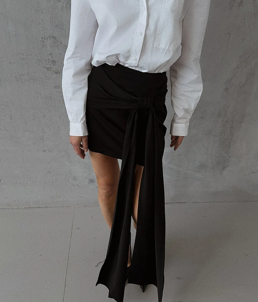 

2026 Women High Waist Pathwork Asymmetrical Hem Bodycon Skirts New Solid Sexy Spliced Bandage Mini Skirt Female Autumn Clothing