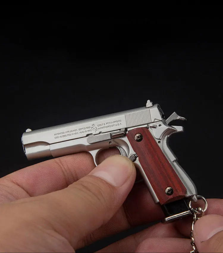 Mini Gun Toys 1/3 Metal 1911 Keychain Shell Eject Wood Grip Toy Gun Miniature Collection of Alloy Pistols Pendant for Gift