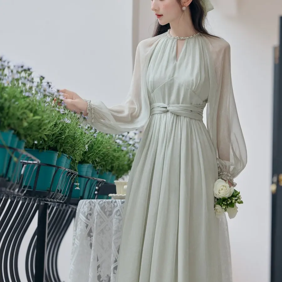 

Женская весенняя новинка: юбка с жемчужным декором и поясом для подчеркивания талии, нежная, как у феи, с длинными рукавами, из полиэстера и шифона.