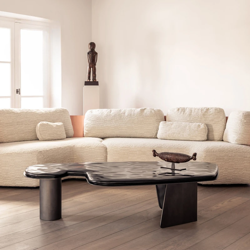 designers create minimalist and irregular stainless steel coffee tables. Small unit living room with solid wood edge tables