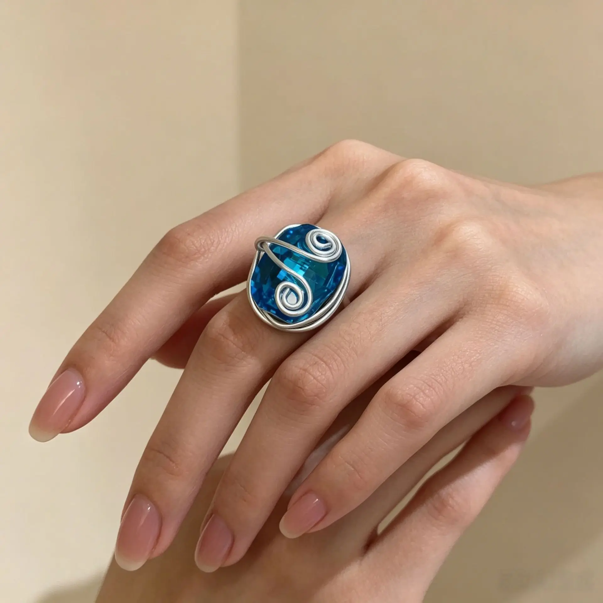 Hand-wound blue crystal ring