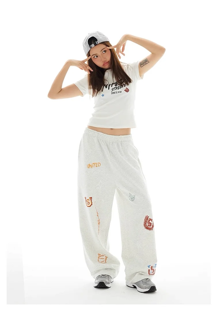 Americano retro graffiti casual cor sólida calças de perna reta para homens e mulheres high street jazz hip hop perna larga esportes