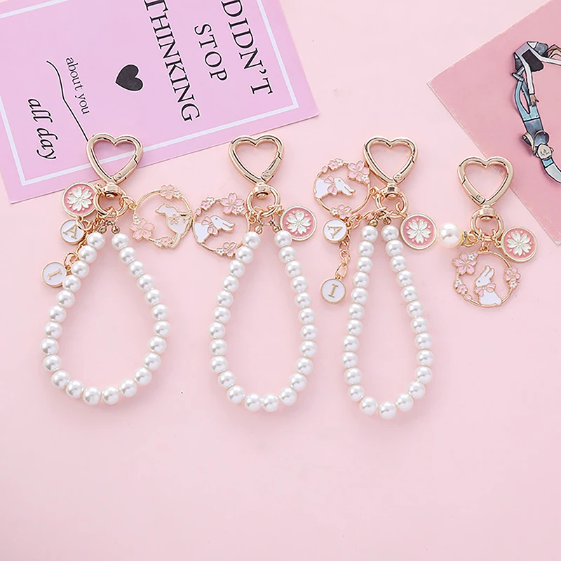 

Sweet Pink Cherry Blossoms Key Chain Rabbit Phone Pendant Pearl Letter Car Key Ring Headphone Case Charms Bag Decor Accessories