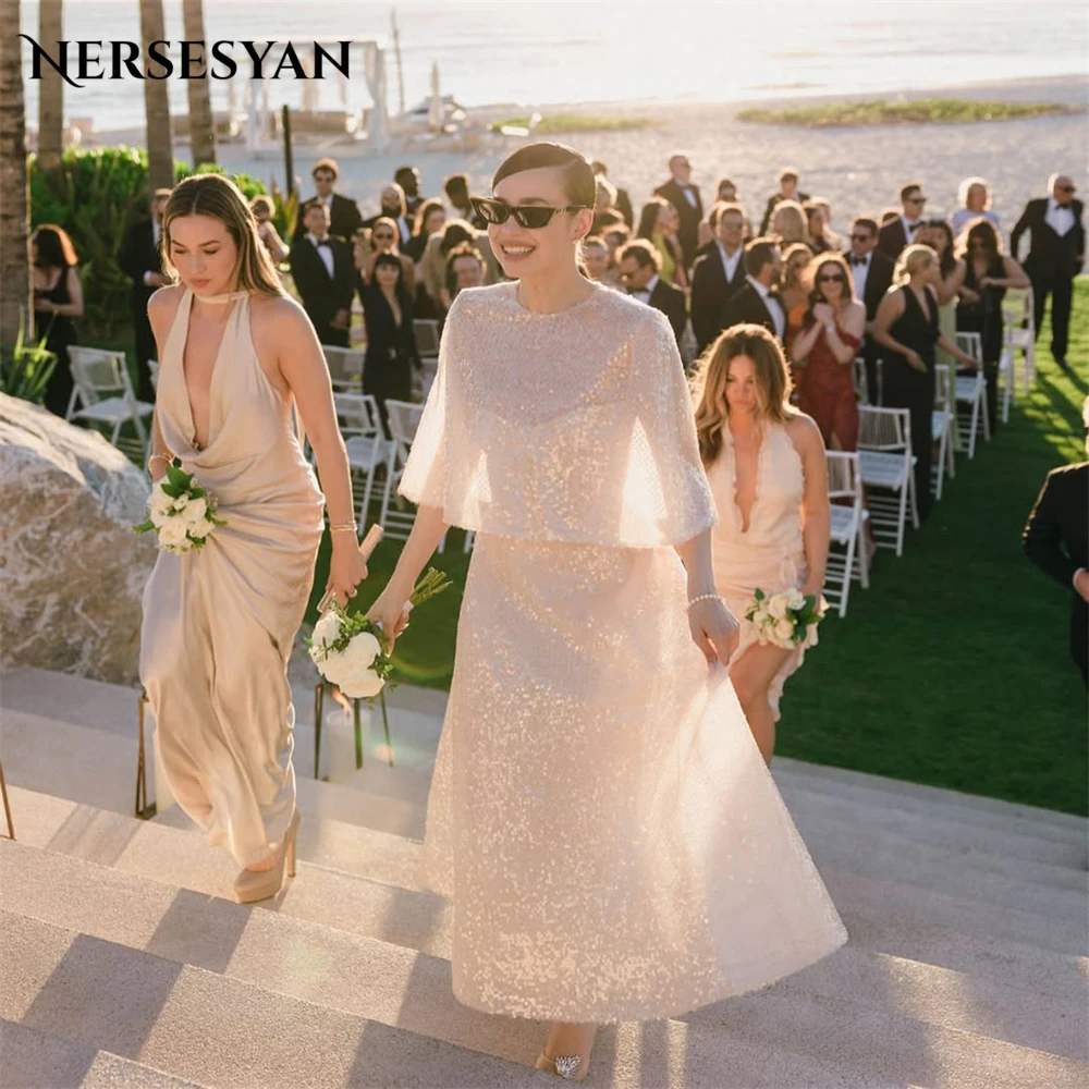 

Nersesyan Элегантные блестящие свадебные платья с круглым вырезом и блестками А-силуэта Свадебные платья с короткими рукавами до щиколотки Платье невесты по индивидуальному заказу