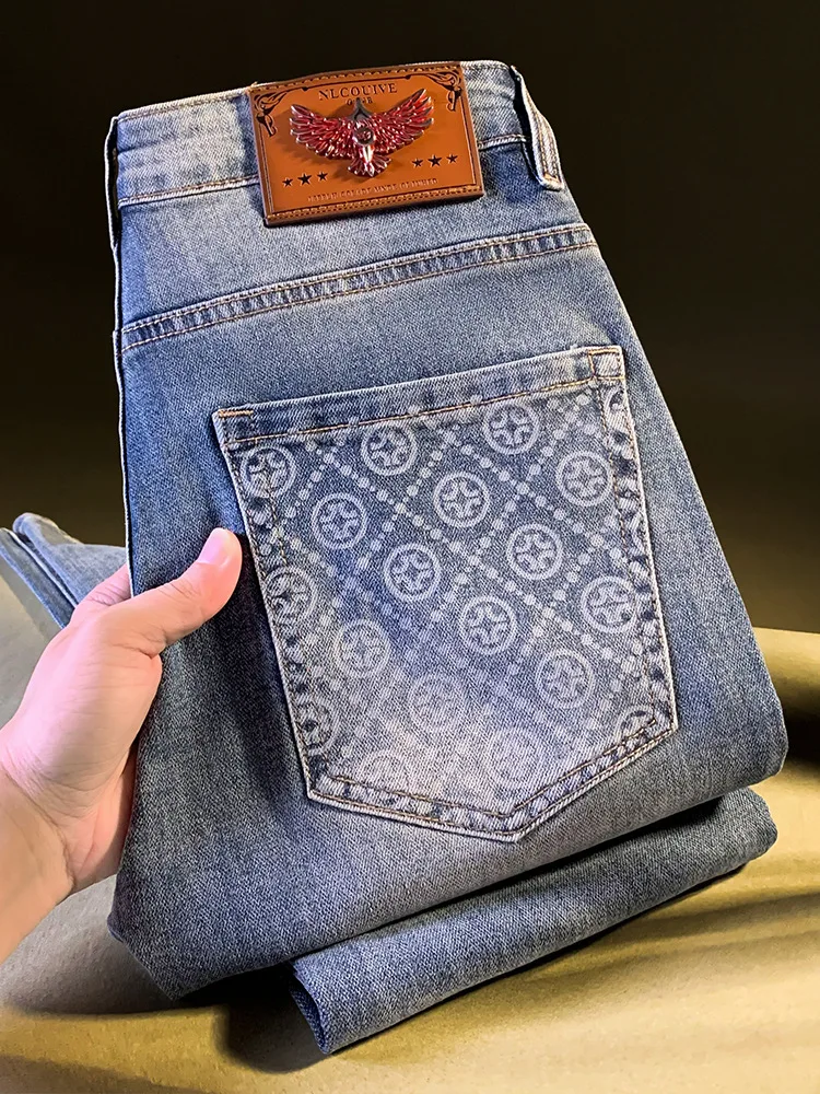 

High end light luxury men's jeans trend autumn new item slim fit small foot mid waist retro washed Korean version pants for men