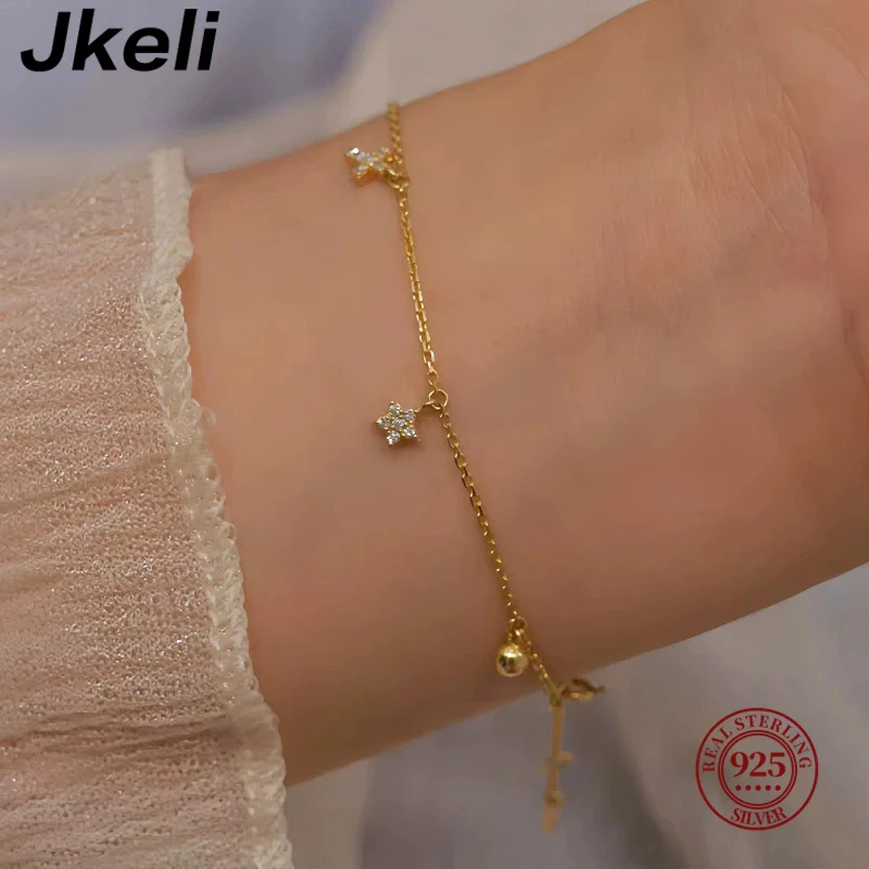 

Jkeli S925 стерлингового серебра 16 К позолоченный браслет со звездой и луной для женщин уникальный дизайн INS стиль небесный крест ювелирные изделия