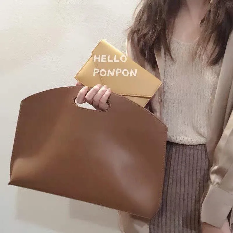 Niche 13-inch laptop bag female, temperament thin hand carry briefcase PU leather light luxury texture