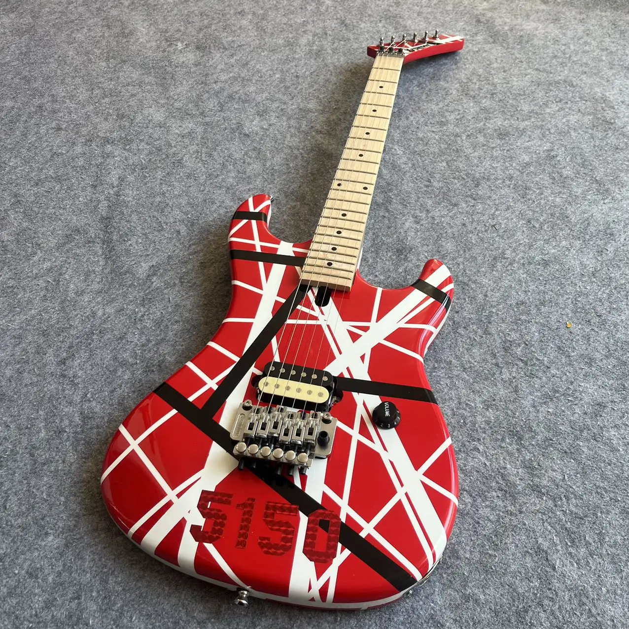 

5150 electric guitar, imported alder body, Canadian maple fingerboard, signed, classic red and white stripes, lightning package