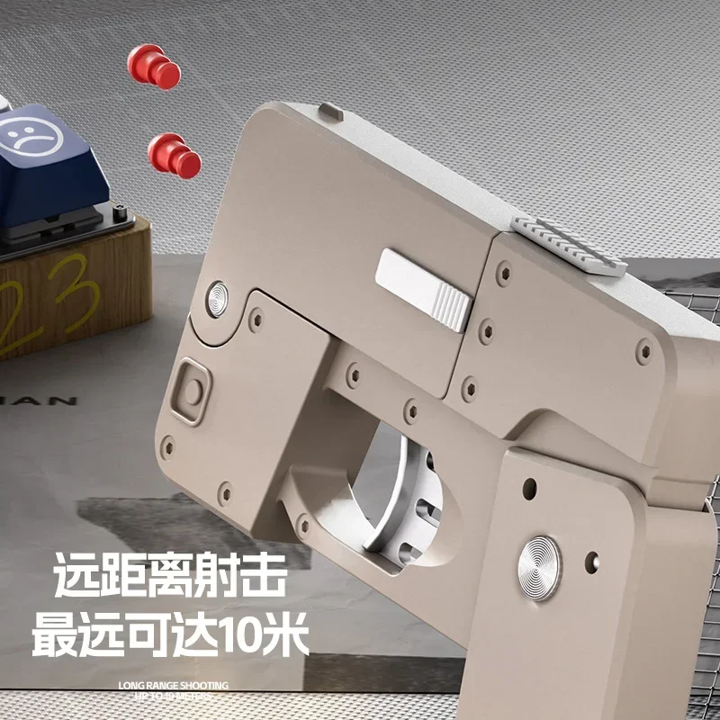 2025 Shell Espulsione Deformazione Ic380 Pieghevole Pistola a spruzzo per telefono cellulare Pistola a proiettile morbido Può lanciare la pistola giocattolo Modello Regalo di Natale