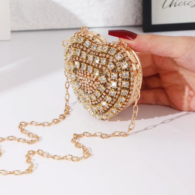 Mini bolso de noche con ajuste de diamante en forma de corazón, bolso de mano de lujo con diamantes de imitación dorados ostentosos para mujer, monedero con diseño de cadena Simple