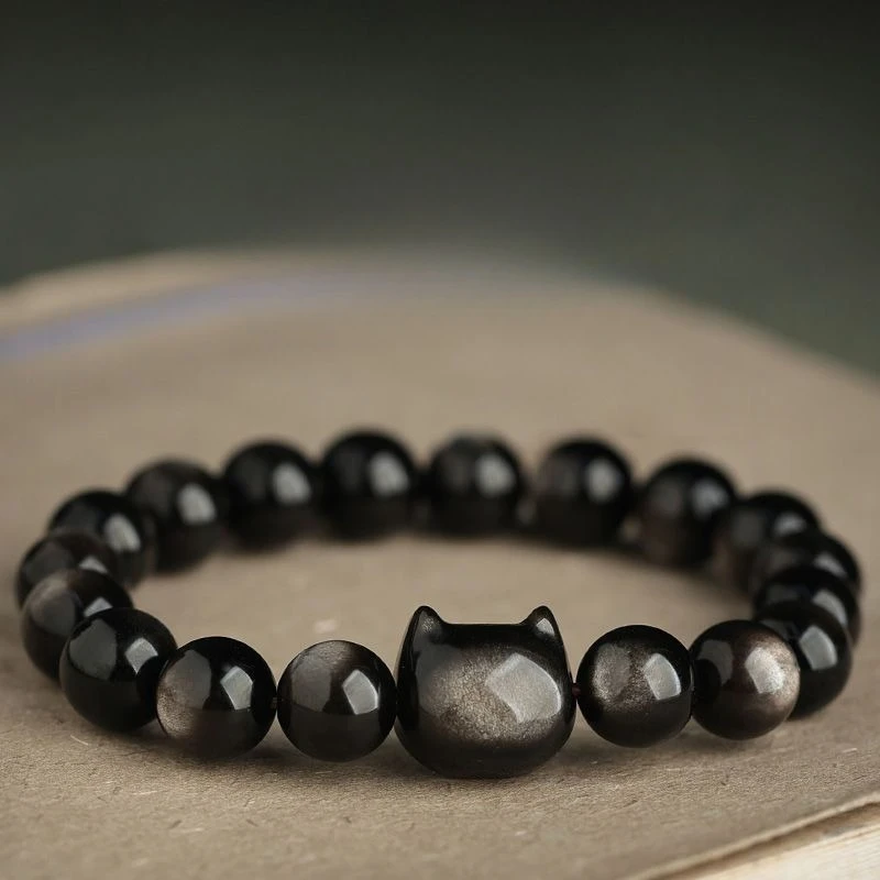 

Серебряный браслет с головой кошки из обсидиана в стиле ночной эльфийки, подарок