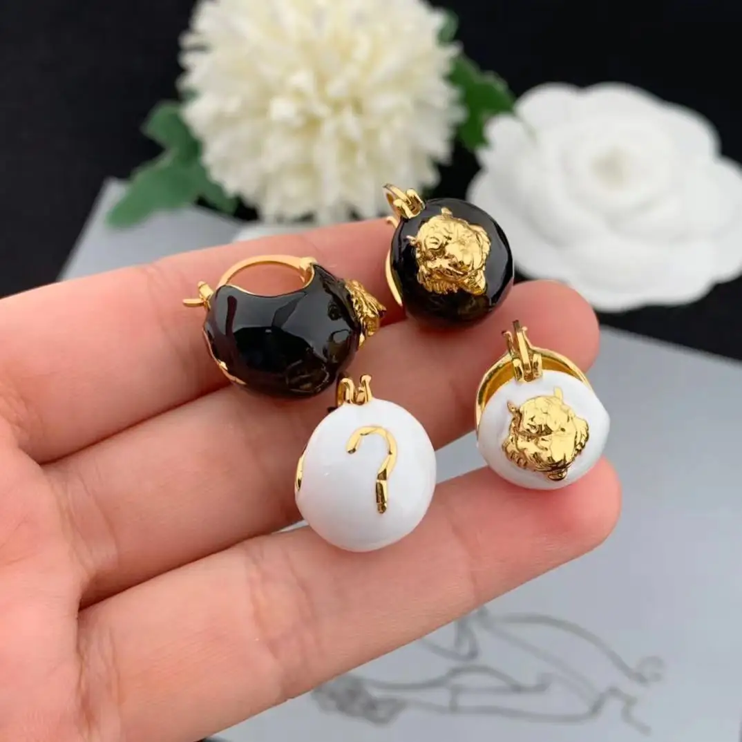 

European and American Fashion Lion Head Black and White Oil Dropping Earrings