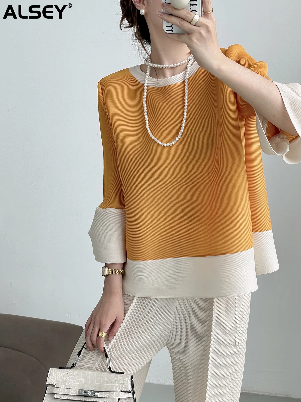 

ALSEY Miyake Pleated Color Blocking Loose Slim T-shirt Female Summer New Plus Size Temperament Simple Elegant Lantern Sleeve Top