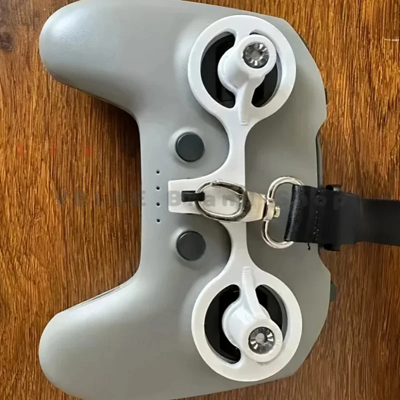 Reserved hidden buffer slot for DJI FPV Remote‑Controller organise charging wires while the handheld shell wraps the controller