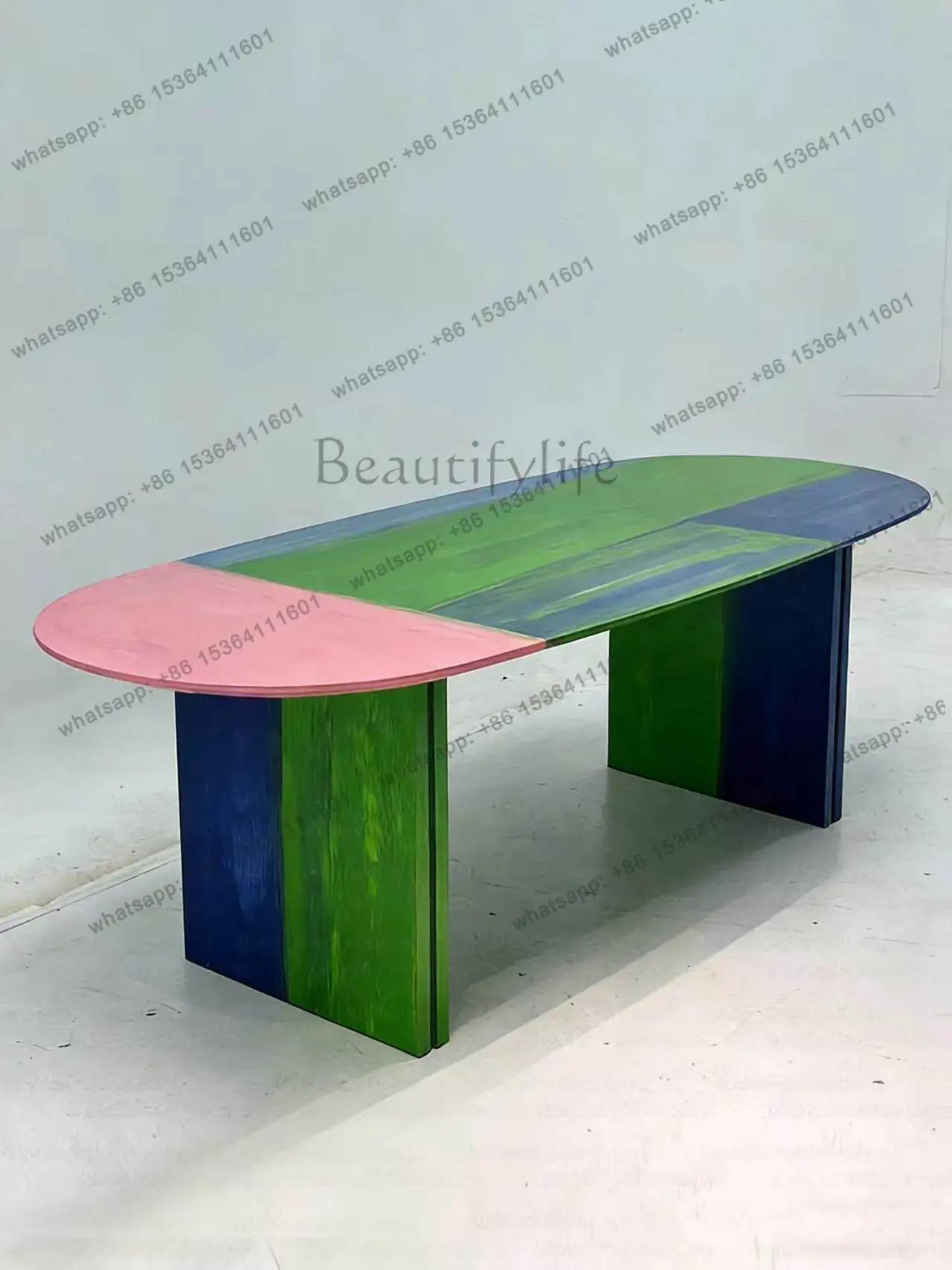 Modern designer creative dopamine personality painted solid wood dining table simple oval high-end artistic dining table