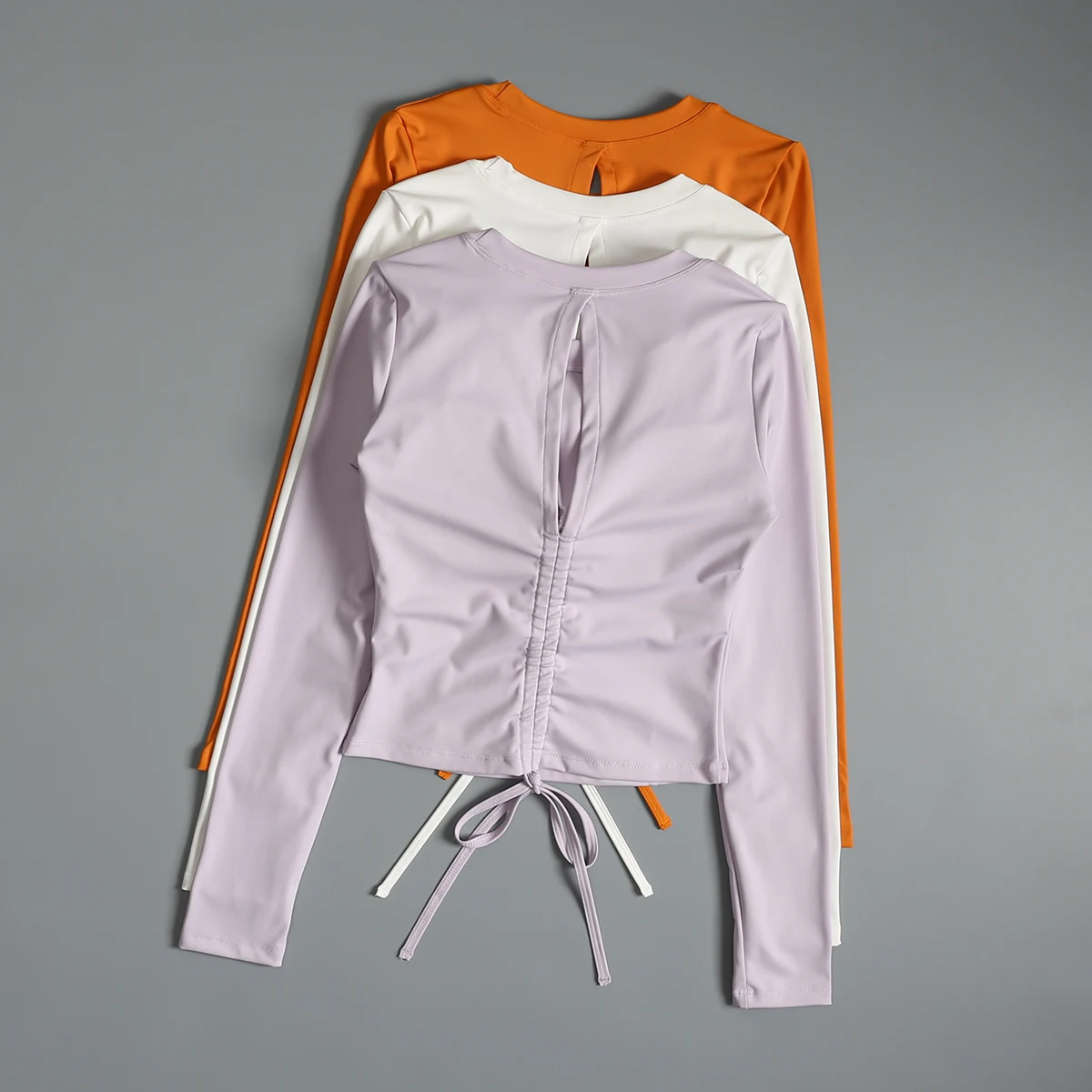 

Yoga clothes top for women with chest pad slim fit and slim sports long sleeves beautiful back sexy drawstring pleated running