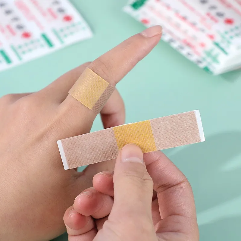 100 ชิ้นยืดหยุ่นแผลกาวพลาสเตอร์ Breathable Skin Medical Band Aid First Aid Home Travel Outdoor Camp ชุดฉุกเฉิน