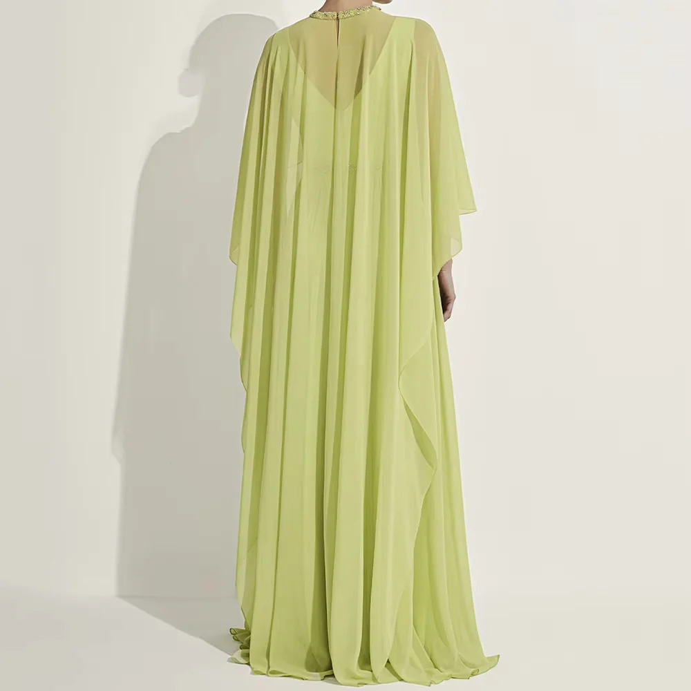 Elegant modest maxi abaya dress with cape sleeves and pleated long skirt. Soft chiffon fabric, matched waist belt. Suitable for