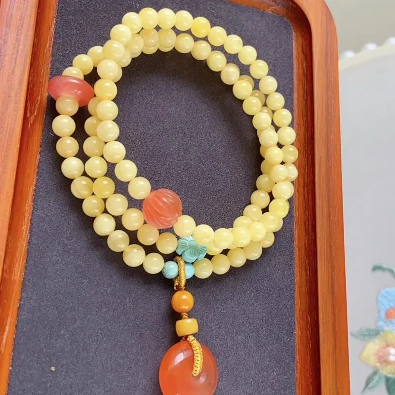 Natural Russian amber bracelet three strands featuring a full honey-white floral pattern paired with South Red Agate and