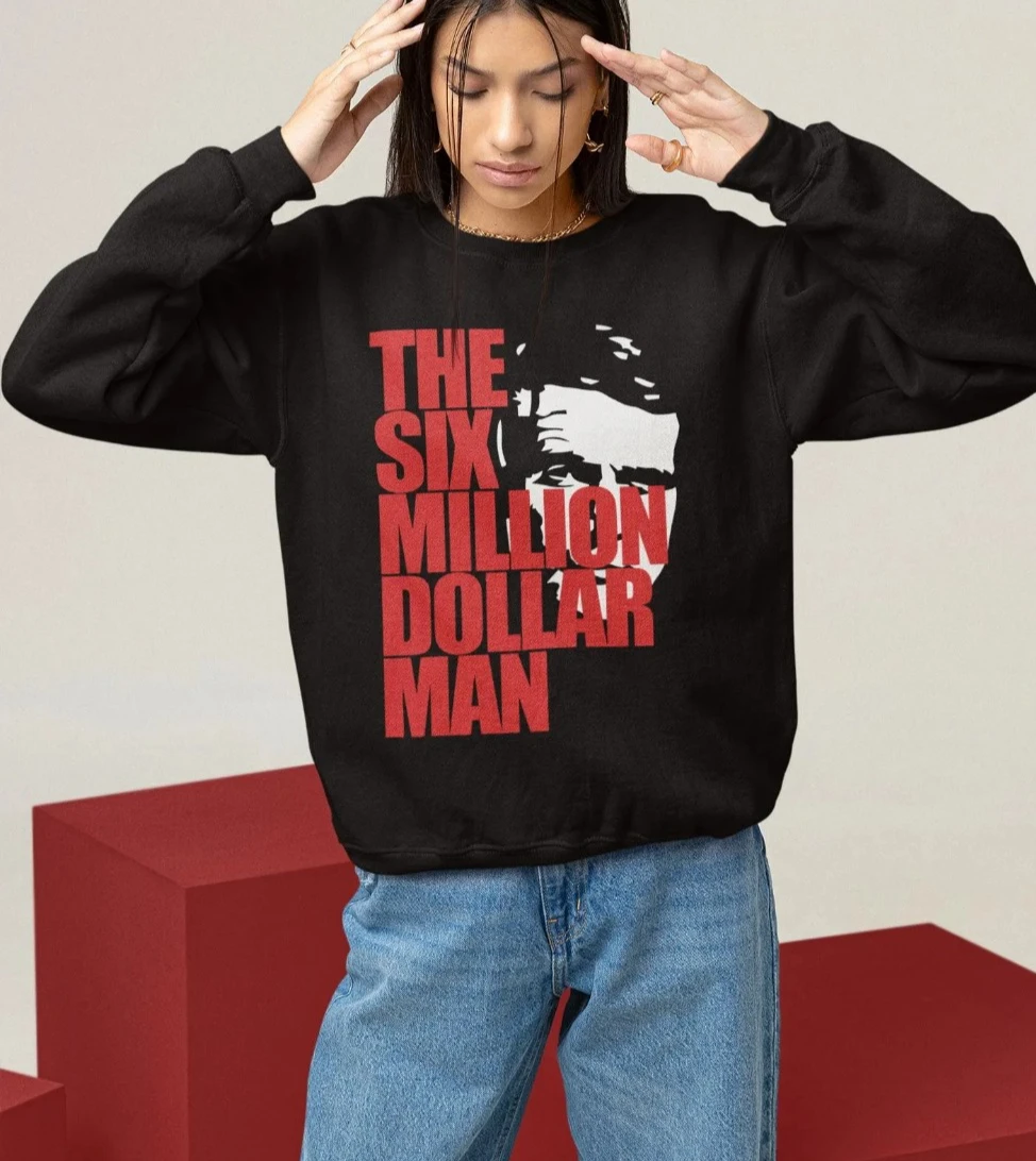 سترة بقلنسوة "The Six Million Dollar Man": سترة Steve Austin Movie Graphic للجنسين بغطاء للرأس كبيرة الحجم لجميع المواسم