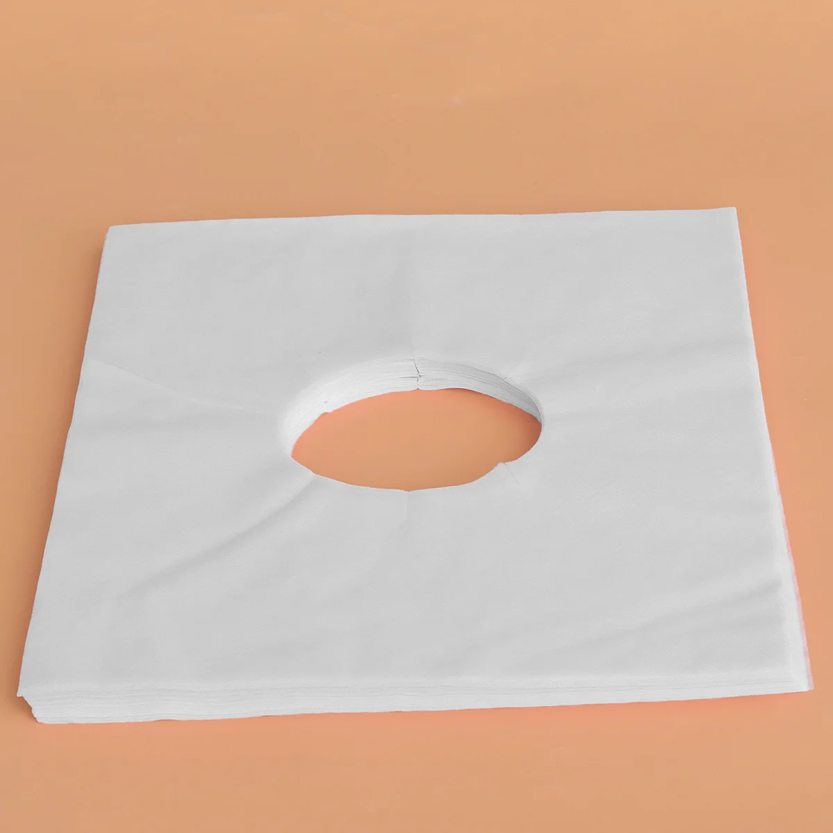 

100Pcs Women Face Massage Cover Pad Non-Woven Fabric with Silica Gel Surface for Salon Spa Breathing Comfort Face Hole Mat