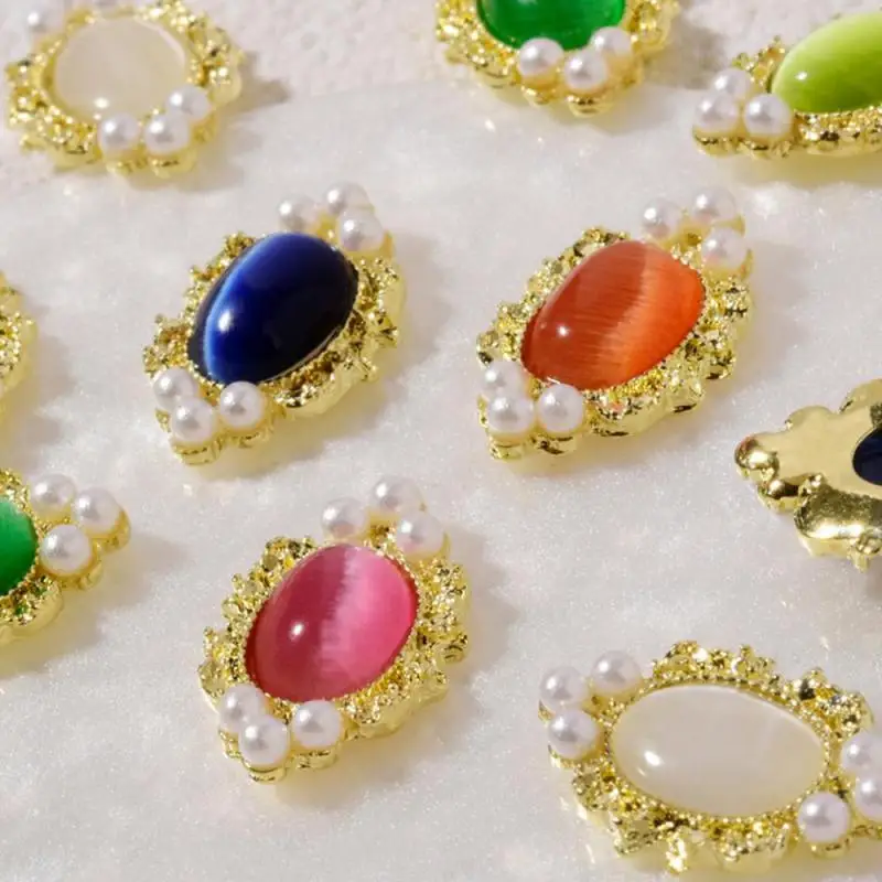 Białe akcesoria do zdobienia paznokci Wysokiej jakości perłowe wiertło do paznokci Przyciągające wzrok modna biżuteria ze stopu kociego oka Akcesoria do paznokci