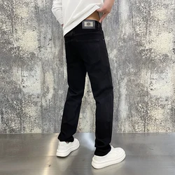 High-end Korean version of the light luxury men's jeans autumn and winter black elastic Slim fashion verse men's troupers