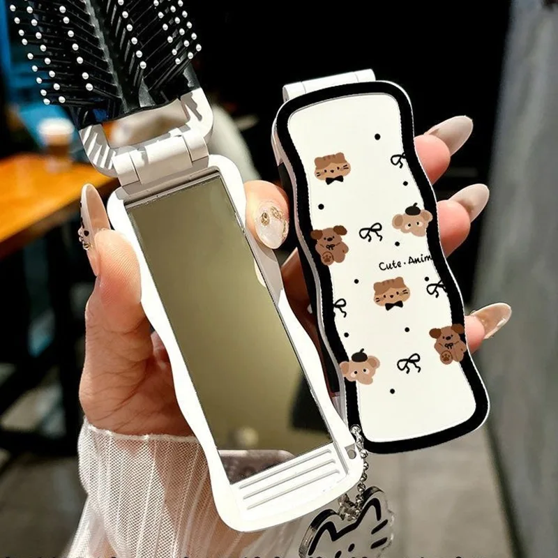 

Bow shaped bangs folding comb, portable mini cat soft tooth comb, minimalist built-in mirror integrated comb