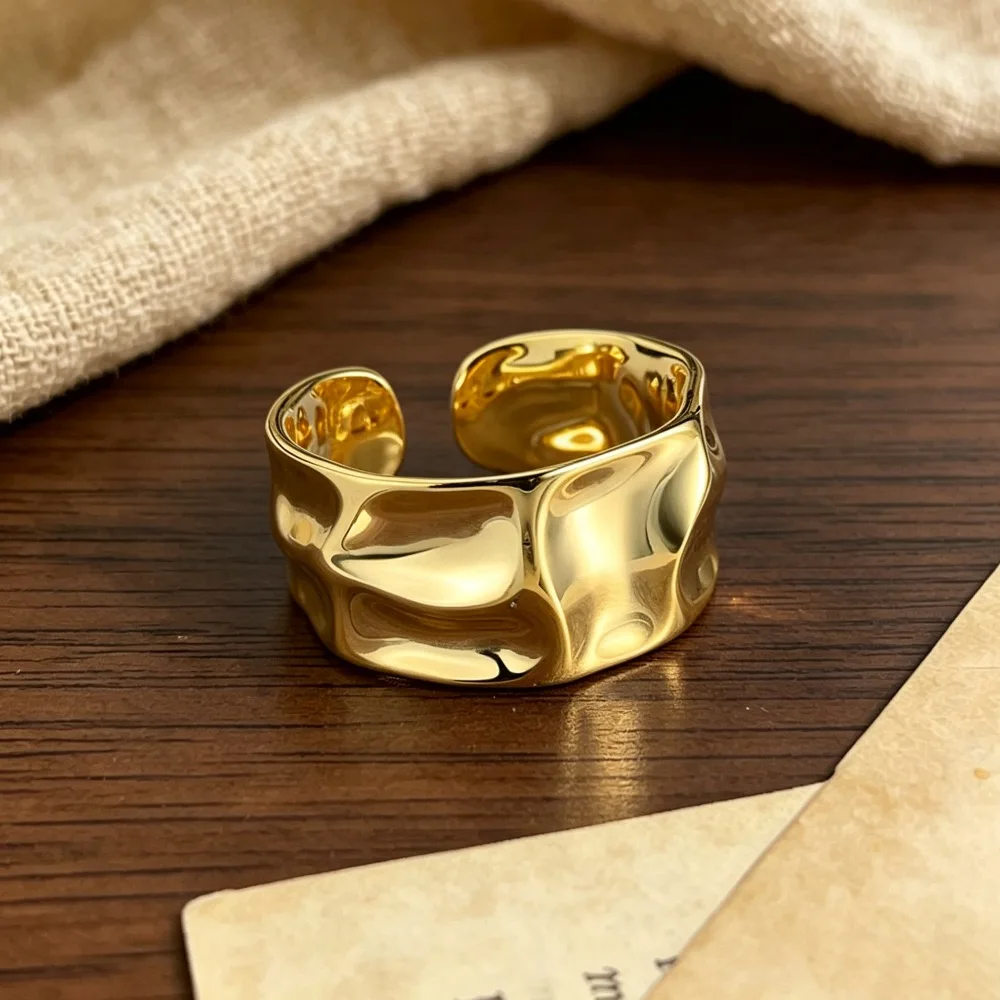 Irregular opening golden ring, adjustable size, with a wide design of concave and convex surfaces for women's rings.