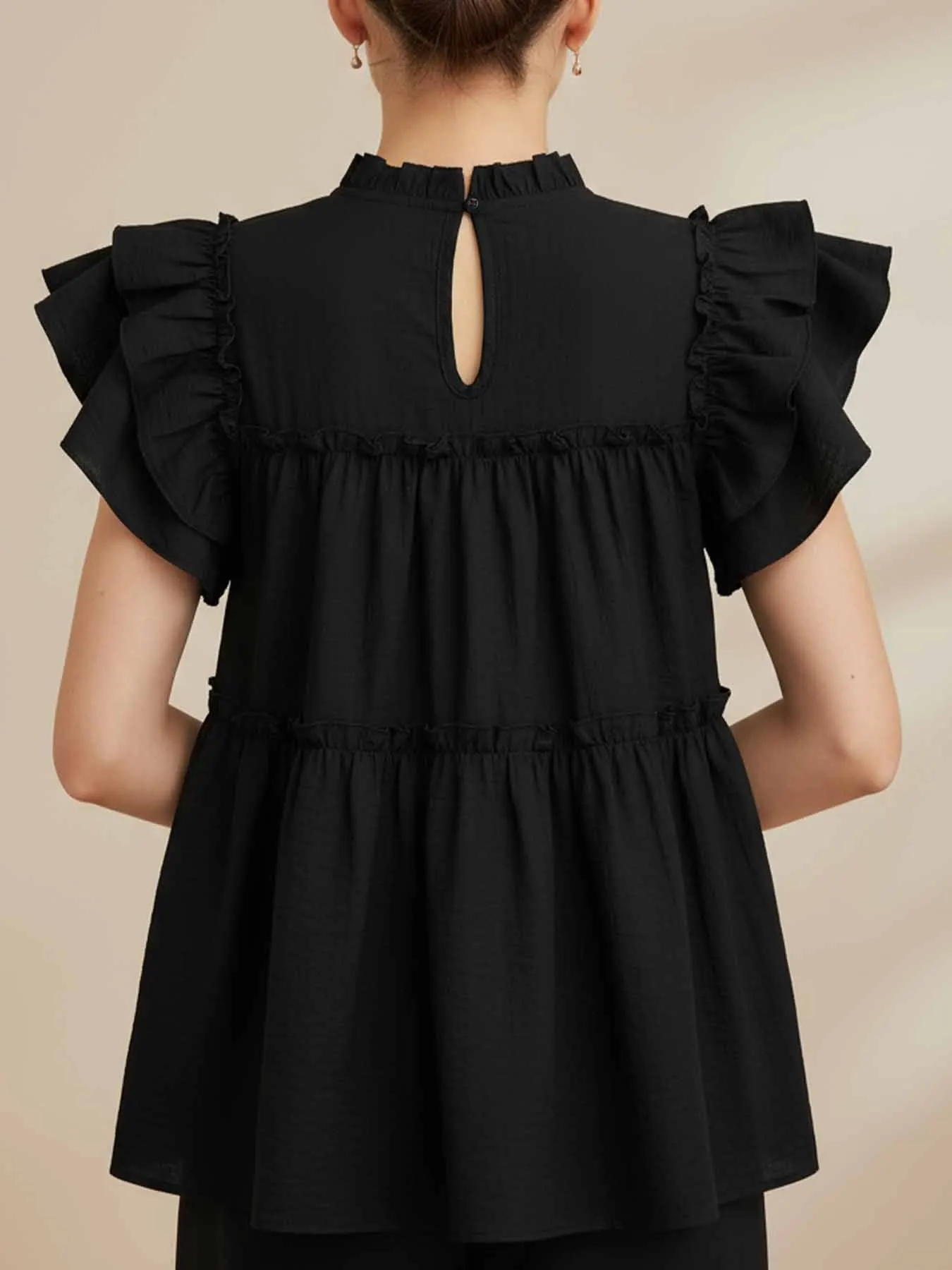 Women's 100% cotton babydoll-style top featuring a lettuce-edge neckline and double-layer ruffled flutter sleeves.