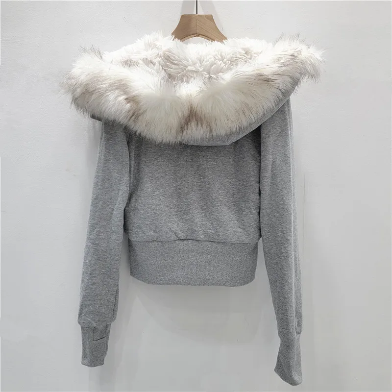 

Stylish & cozy fitted short puffer jacket with faux fur hood. A trendy winter essential for women.