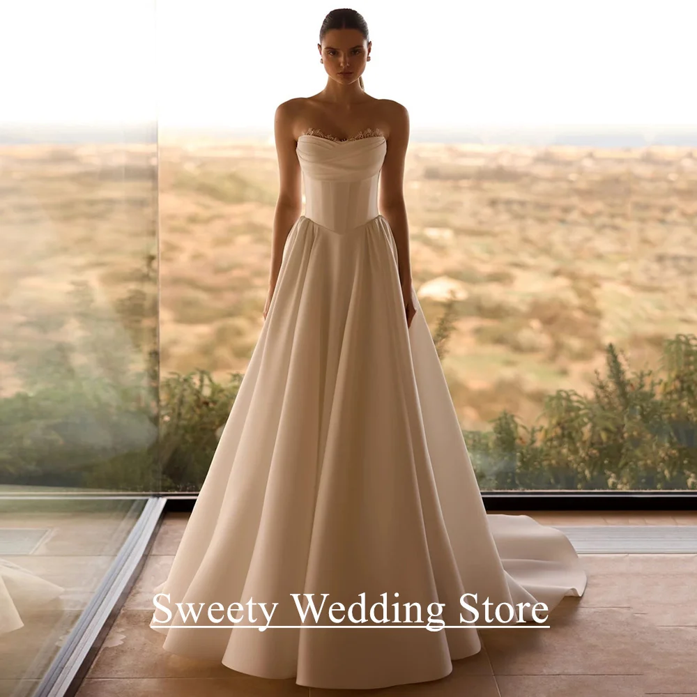 Robe de mariée moderne personnalisée, sans manches, col en V, plissée au dos, fermeture éclair, jupe drapée, ligne A, robe de mariée en Satin, traîne de balayage