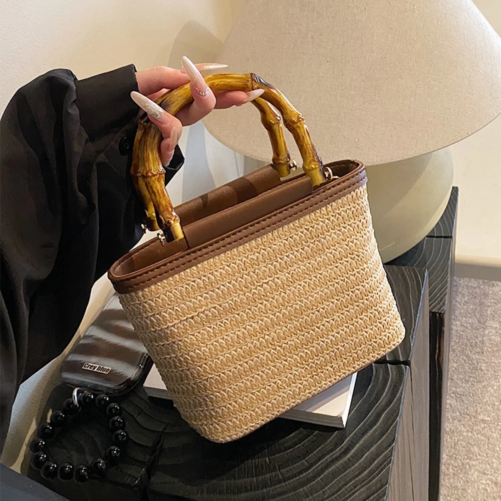 

Bohemian style Bamboo Handle Woven Straw Bucket Bag, Summer Beach Crossbody Handbag Detachable Strap Vacation Tote for Daily Use