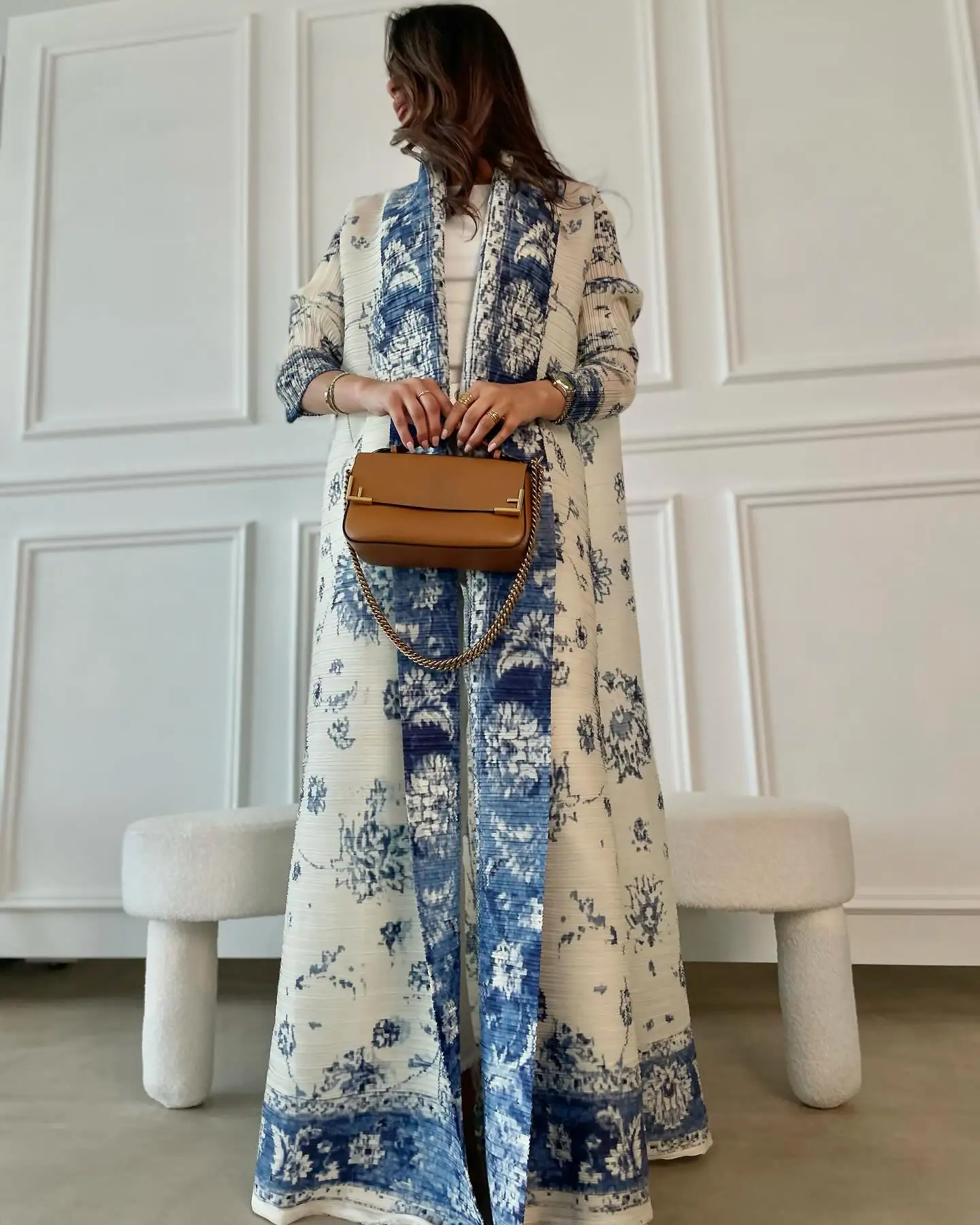 Women's Muslim abaya robe, blue and white floral print, loose-fitting with an open front, and a matching belt.