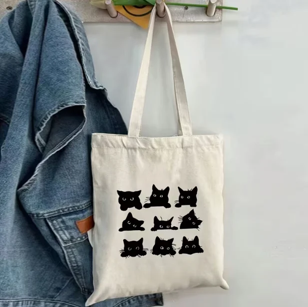 حقيبة يد قماشية بنمط قطة سوداء للنساء حقيبة تسوق بكتف واحد مطبوعة على شكل قطة لطيفة للاستخدام اليومي حقيبة كتف مفردة #1