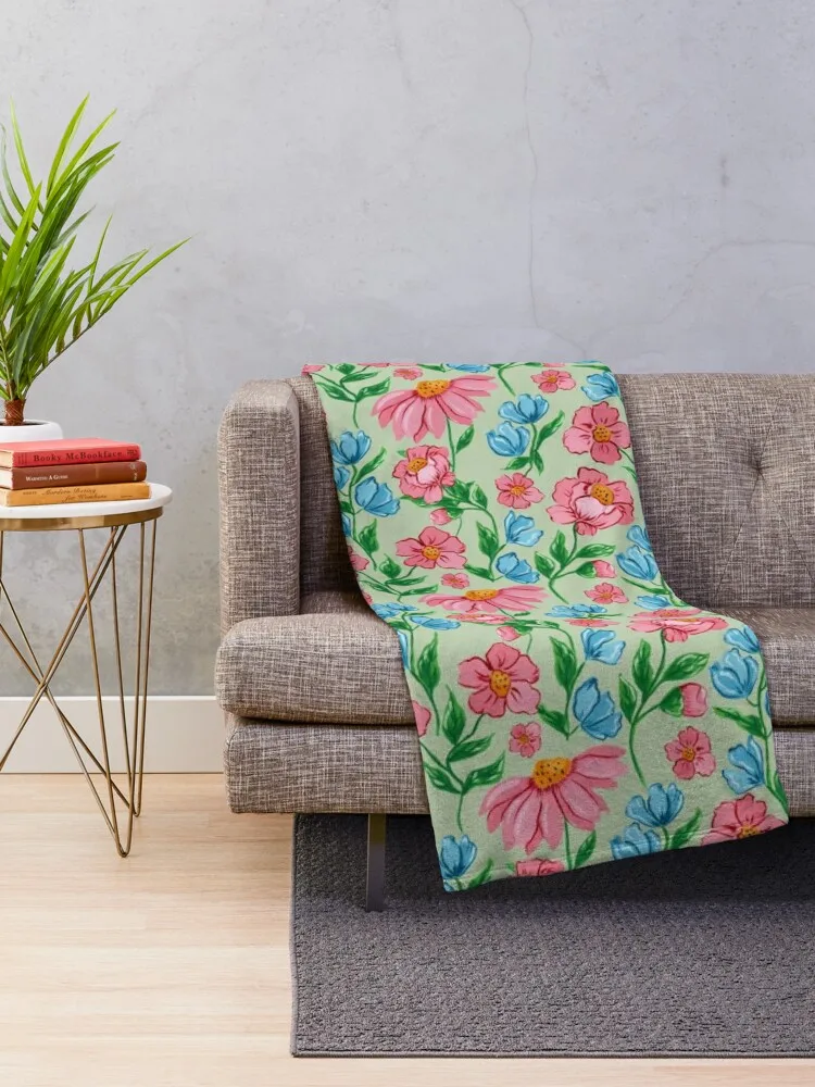 Hand painted painterly feminine gouache pink flowers and blue flowers on a light green background Throw Blanket