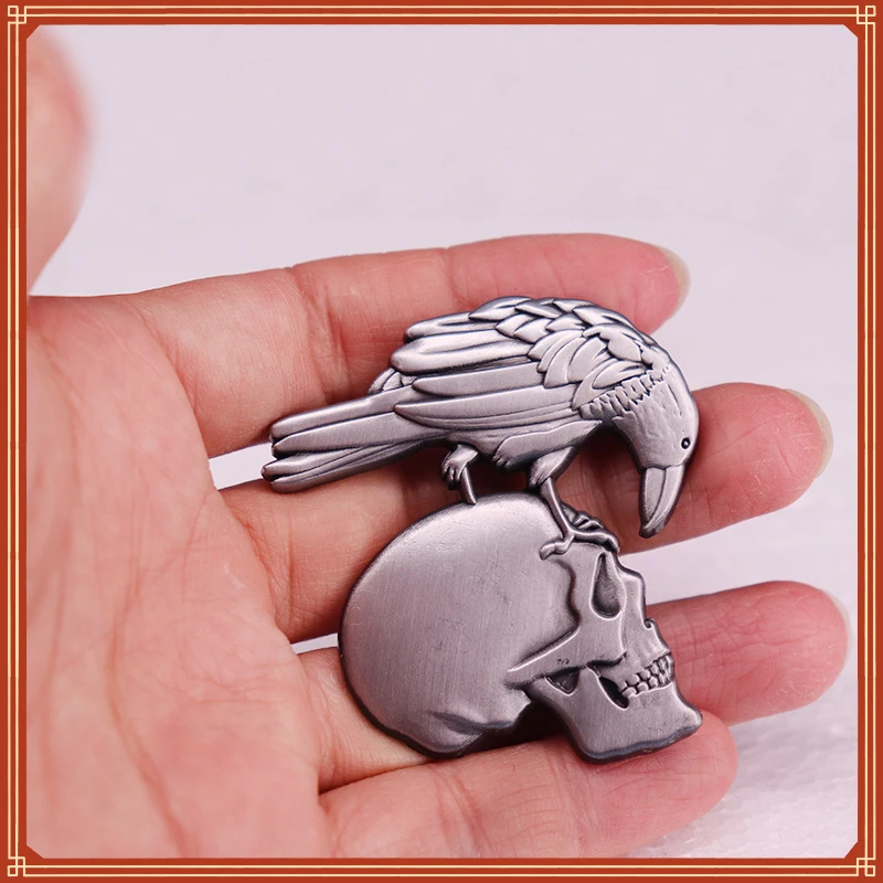 Crow skull brooch