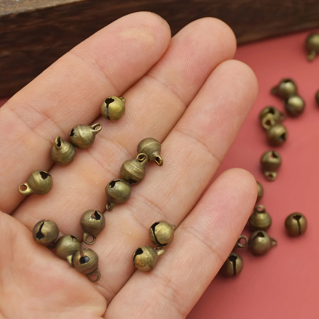 100pcs  Mini Jingle Bell Vintage Bronze Small Elliptical Antique Brass Bell for Crafts and Christmas Halloween Festival Decor