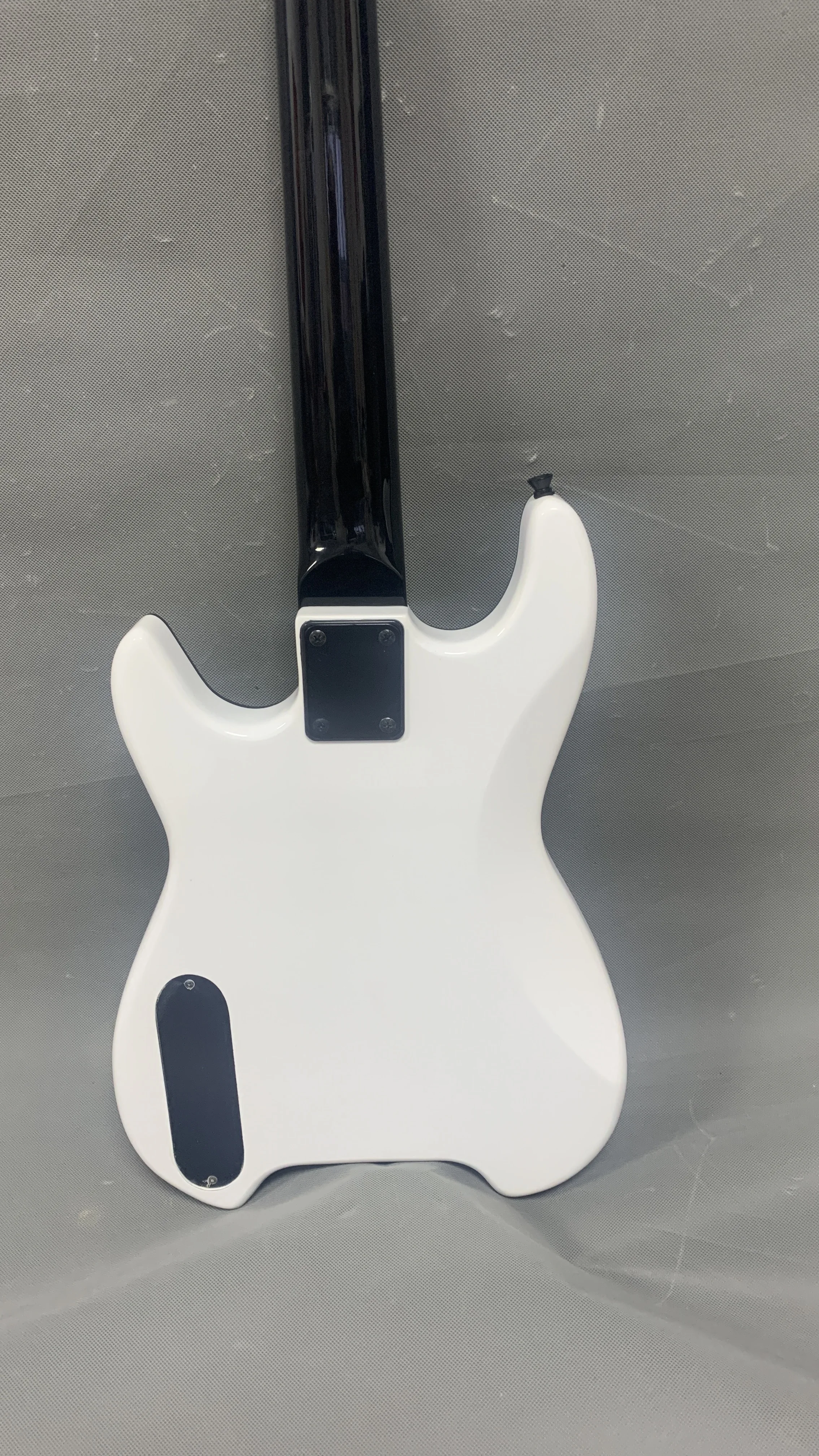 Classic 4-string headless bass guitar, white body black neck, high-end headless bridge, custom headless guitar of various styles