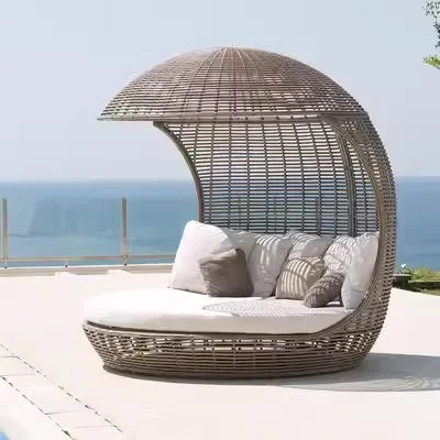 Outdoor rattan sofa combination bird cage round bed lying on the bed