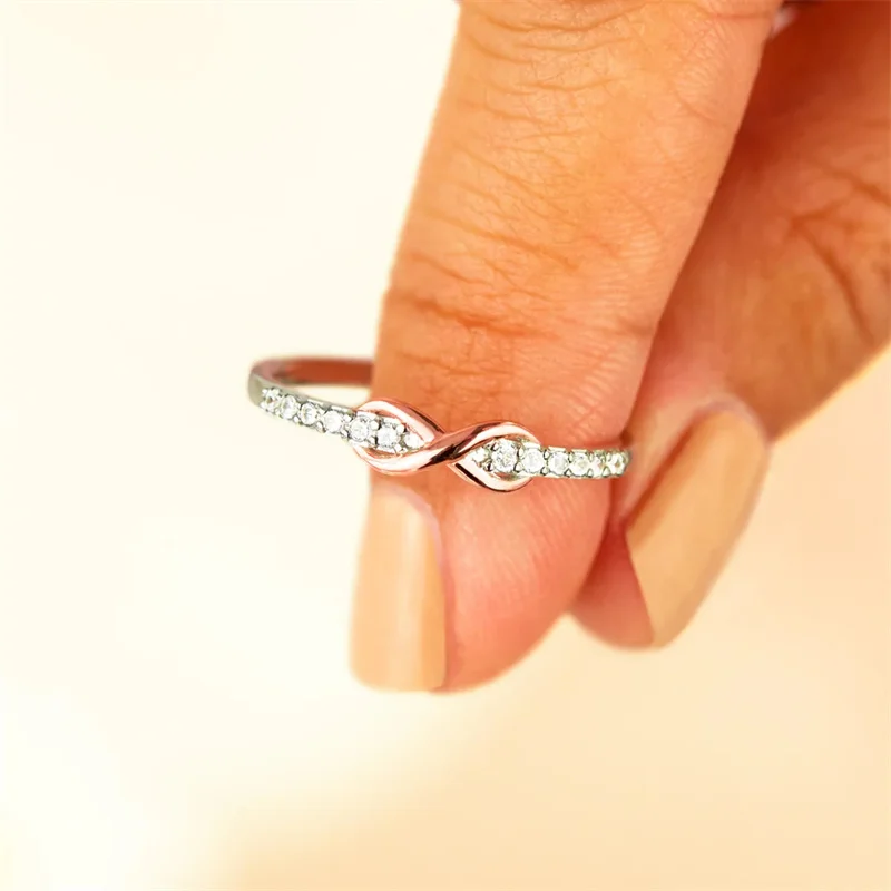 Huitan elegante Unendlichkeit Figur acht Form Frauen Ringe mit rosa Zirkon exquisiten weiblichen Fingerring Eheringe Schmuck