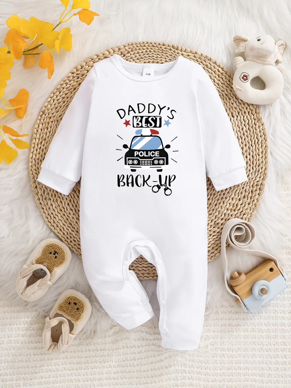 A baby long-sleeved onesie with interesting letter prints. It features a buttoned design for easy putting on and taking off