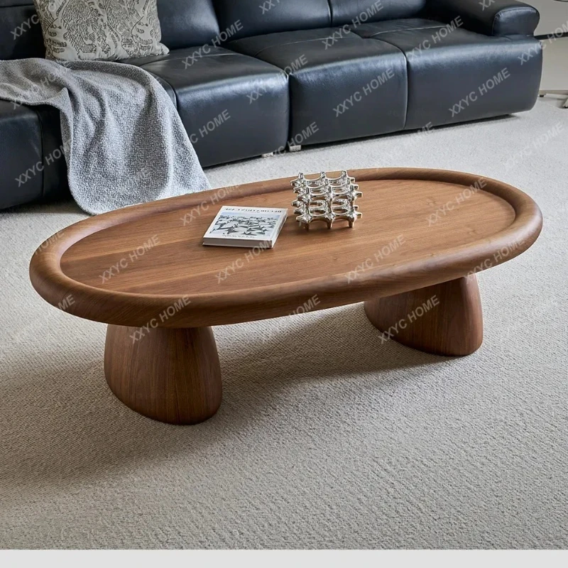 A minimalist oval black walnut coffee table living room modern simple light luxury high-end coffee table