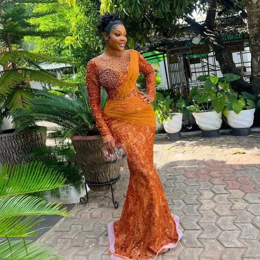 فساتين سهرة برتقالية أفريقية Aso Ebi حورية البحر بأكمام طويلة من الدانتيل واللؤلؤ للحفلات الراقصة للفتيات السود حسب الطلب