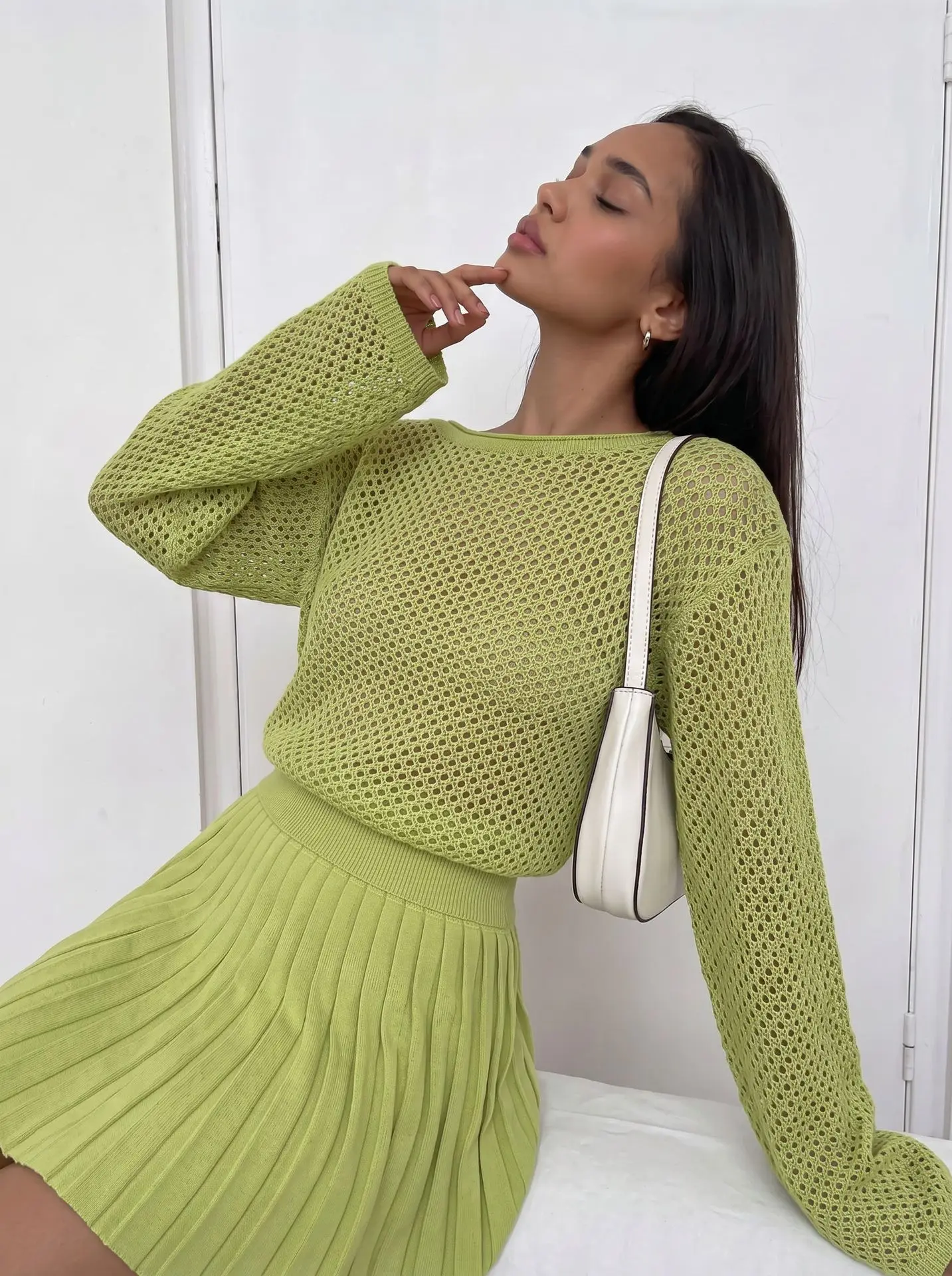 2026 new European and American style hollow-out knitted suit for women  loose and slouchy sweater + pleated skirt two-piece set