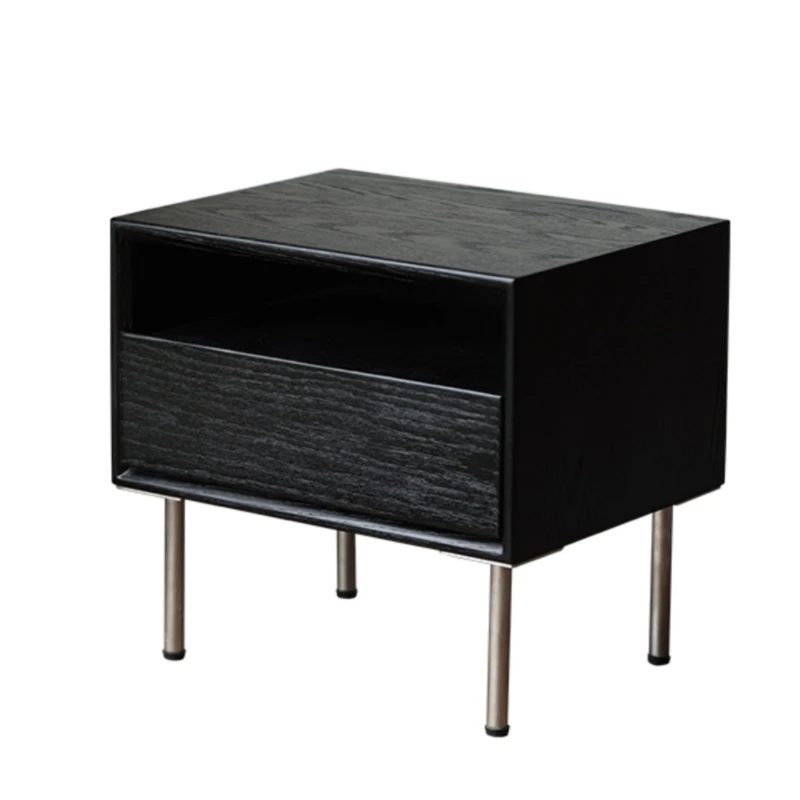 The bedroom bedside table is minimalist, modern and creative, with stainless steel legs and a black color scheme. The bedside