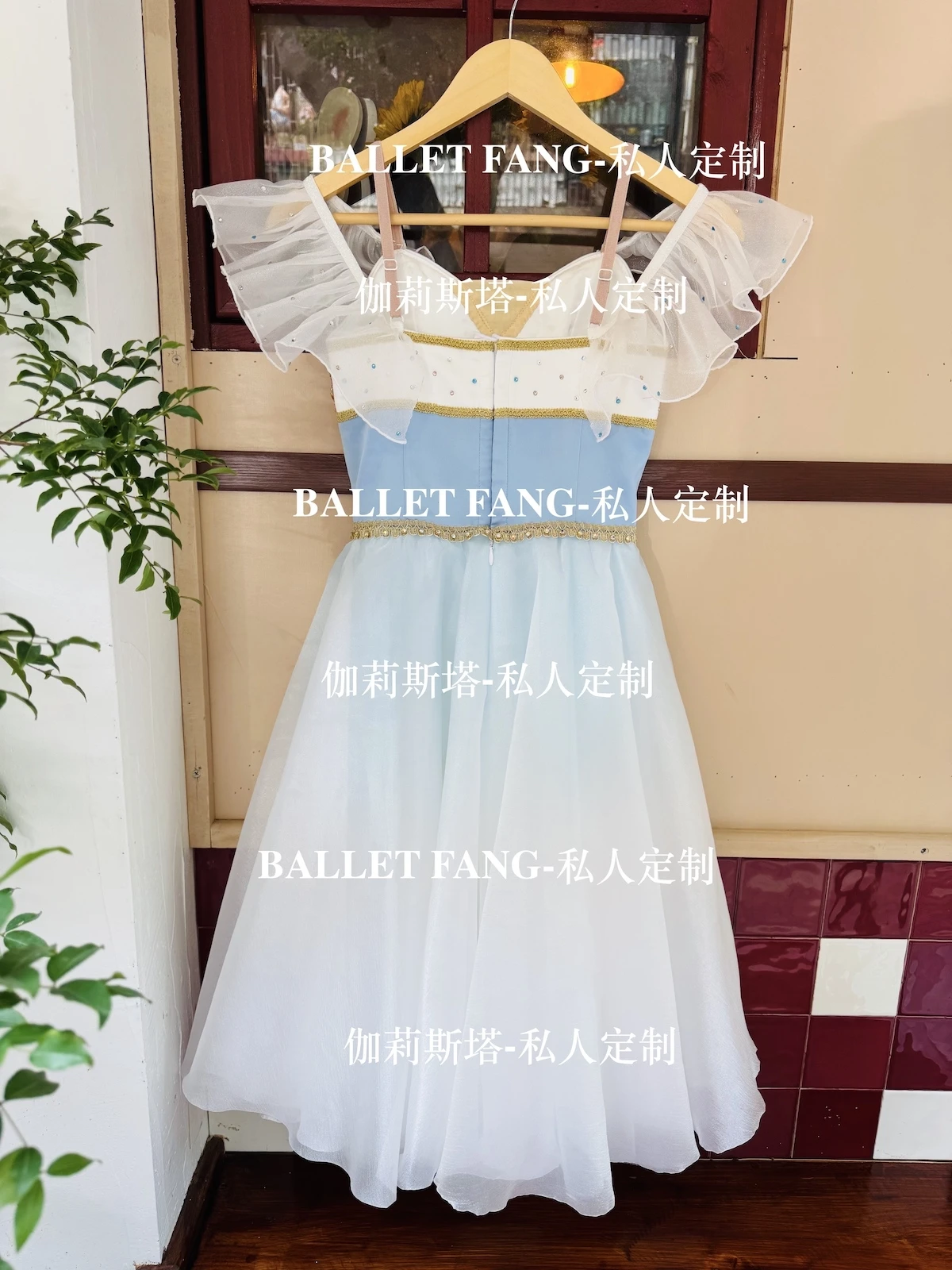 A custom-made ballet dress for the Swan Lake scene, with a blue gradient color, gold sparkling diamonds and a white long chiffon