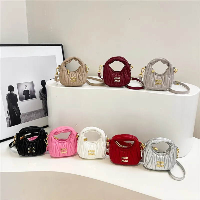 

Min pleated hand-held underarm dumpling bag mini 2025 new niche crescent shoulder crossbody children's bag